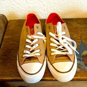 Brand new dark tan converse, with red contrast.